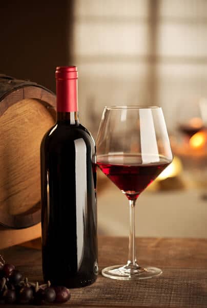 wine tasting with a barrel in the background