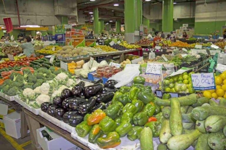 Bustling Paddy's Market in Sydney, showcasing a variety of fresh produce, highlighting the city's abundant fresh food markets as one of the pros of living in Sydney.