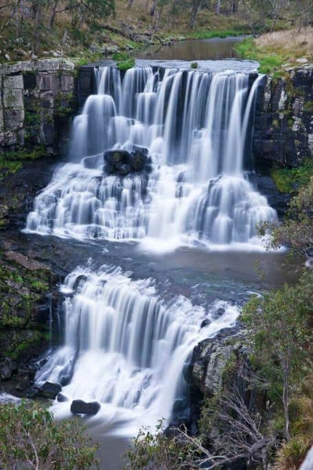 Stunning view of Ebor Falls cascading over rocks, a must-see destination on Australian road trips.