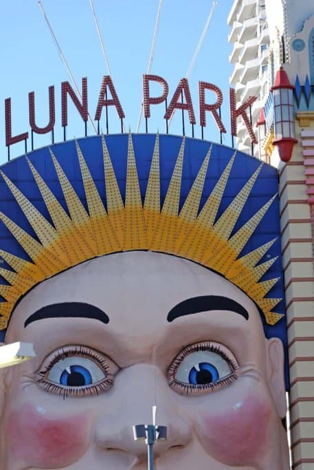 The iconic entrance to Luna Park in Sydney, featuring a large smiling face and vibrant colours. Luna Park is a popular destination for thrill rides and family fun, and it's also a key location for Halloween events, making it a great option for those wondering where to go for Halloween in Sydney.