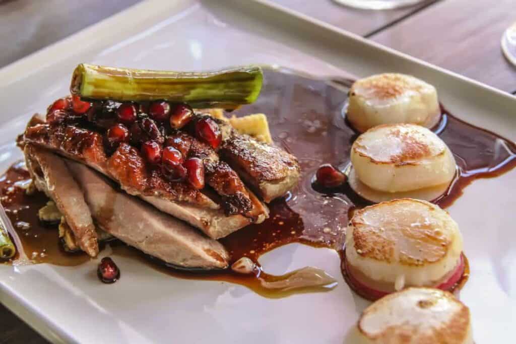 Roast duck with seared scallops at a winery restaurant, a must-try on Gourmet Food Tours, a highlight among the things to do in Margaret River in winter.