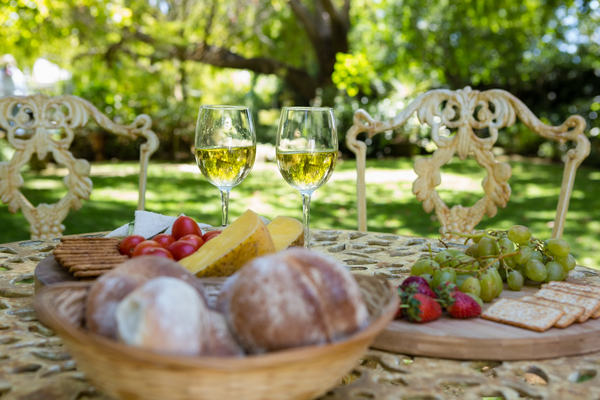 Wine glasses and food on the table