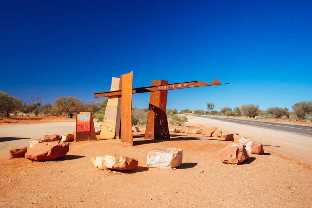 Red Centre Way monument in the Australian outback, marking a notable route for an outback road trip.