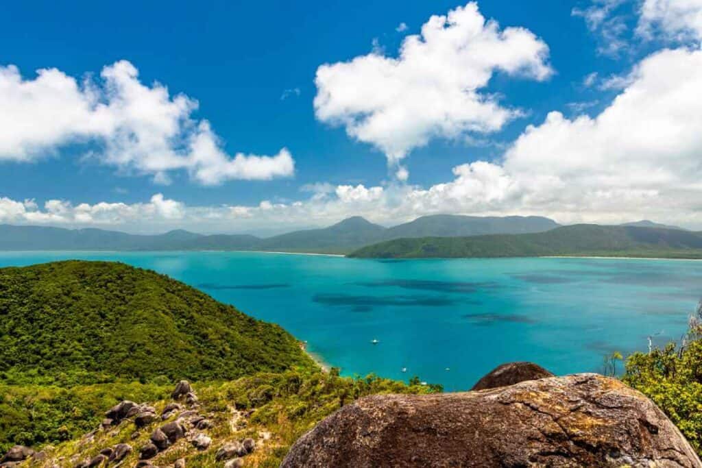 Breathtaking panoramic view from the top of Fitzroy Island, highlighting the turquoise waters and lush greenery that make up the unique winter experiences in Cairns, perfect for nature enthusiasts and photographers.