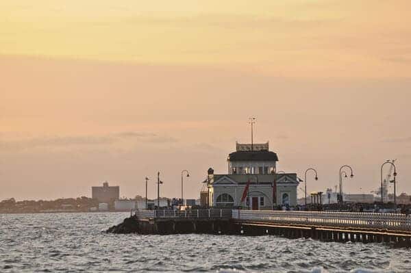 St Kilda Pier in Melbourne at dusk, capturing the serene seaside atmosphere, a highlight of living in one of the best coastal areas in Victoria.