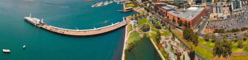 Panoramic aerial view of Geelong coastline, highlighting the urban and natural harmony, a top contender for the best places to live in Victoria with a balance of city and seaside life.
