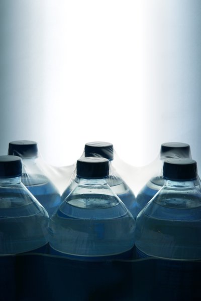 six bottled water in a bright room