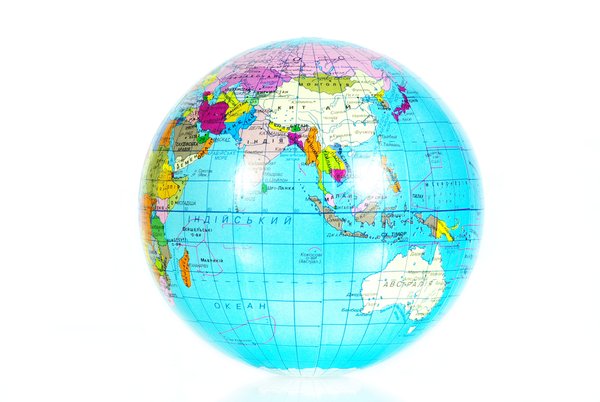 Blue globe isolated on the white background showing latitude and longitude of the world