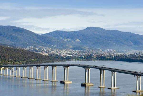 The Tasman Bridge spanning the Derwent River against the backdrop of Mount Wellington, a scenic view for a romantic Valentine's Day river cruise in Hobart.