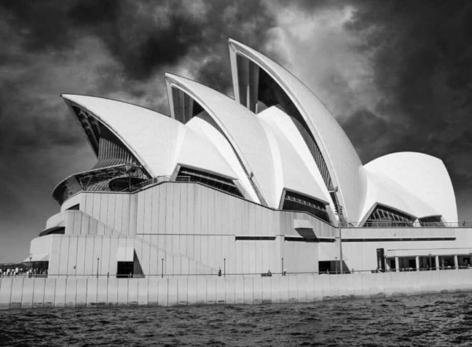 Black and white image of the iconic Sydney Opera House, a highlight on Sydney walking tours along the harbour.