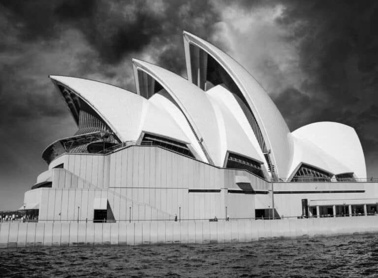 Black and white image of the iconic Sydney Opera House, a highlight on Sydney walking tours along the harbour.