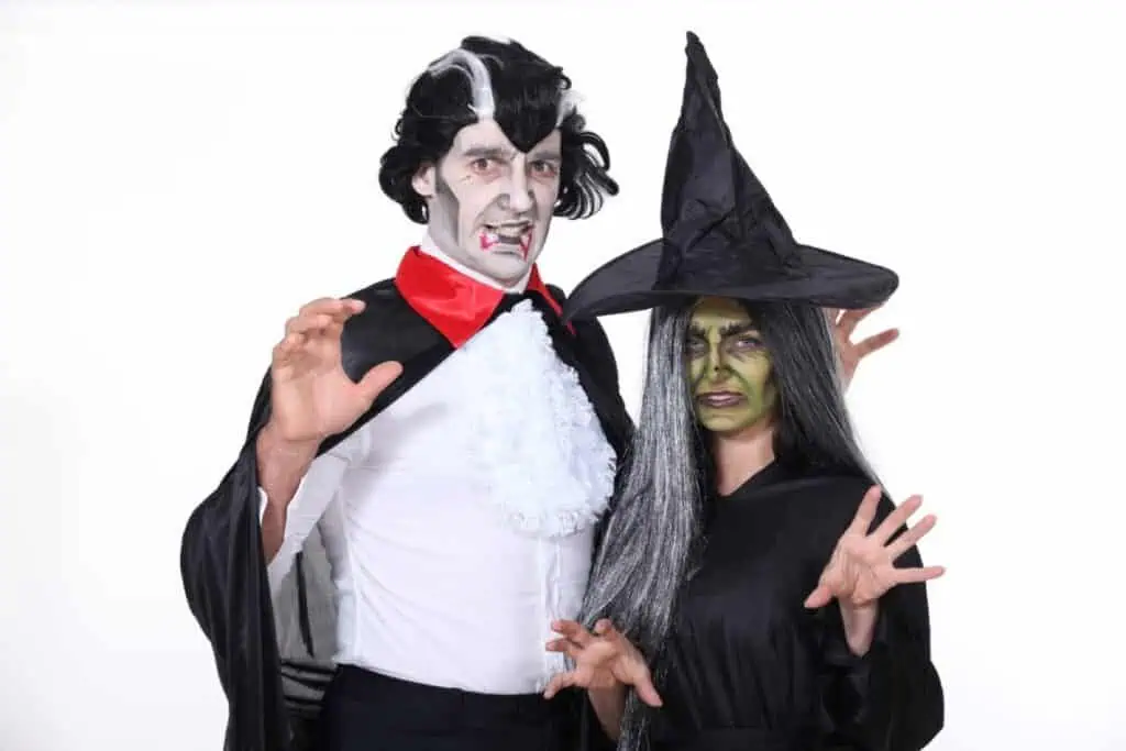 A man dressed as a vampire and a woman in a witch costume, ready for Halloween celebrations. These spooky outfits highlight the fun and festive spirit of Halloween in Sydney.