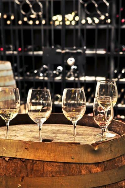 Wine glasses and barrels in aphoto