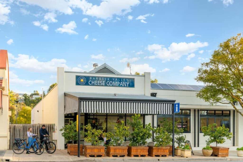 The Barossa Valley Cheese Company storefront with bicycles parked outside. This image highlights one of the attractions in the Barossa Valley, showcasing a popular spot for tasting local cheeses and enjoying the area's culinary offerings.