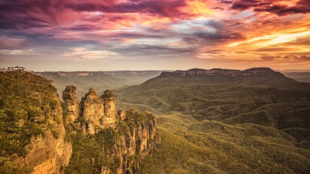 Breathtaking view of the Three Sisters rock formation at sunset in the Blue Mountains, a highlight often included in travel deals in Australia.