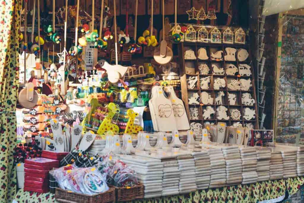 A bustling market stall filled with handmade crafts and decorations, representing one of the popular Cairns Christmas activities where visitors can shop for unique holiday gifts.