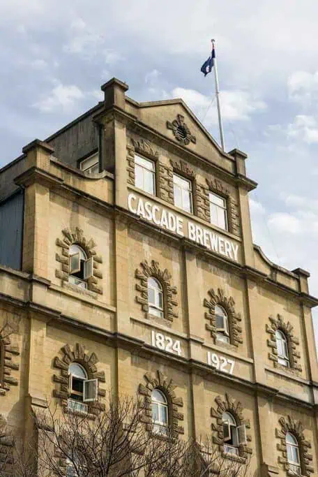 The historic facade of Cascade Brewery in Hobart, dating back to 1824 and 1927, a popular attraction for those looking to explore iconic sites and enjoy local brews on a winter visit to Hobart.