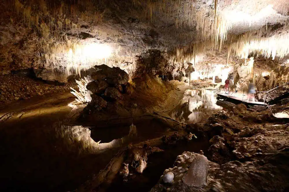 Stalactites reflected in the still waters of Lake Cave, a magical subterranean world to explore as part of winter activities in Margaret River.