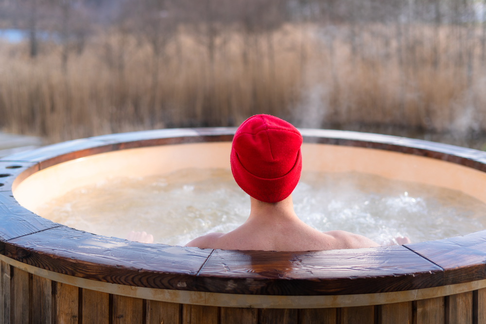 a woman in an outdoor hot tub