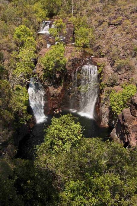 Florence Falls in Litchfield National Park, Northern Territory, with twin cascades flowing into a clear pool surrounded by lush vegetation, exemplifying one of Australia's best waterfalls for nature lovers and adventurers.