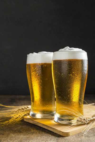 front view glasses of beer with wheat