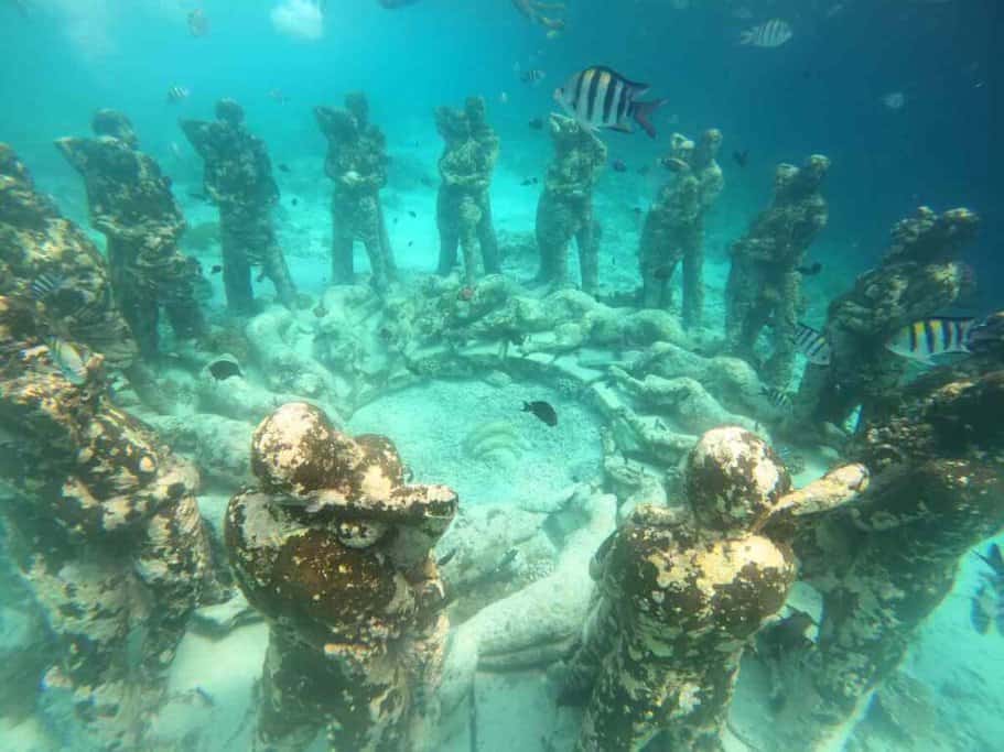 Underwater view of the Nest sculpture at the Gili Meno BioRock reef, surrounded by tropical fish, showcasing the unique snorkelling experiences when travelling to the Gili Islands from Bali.