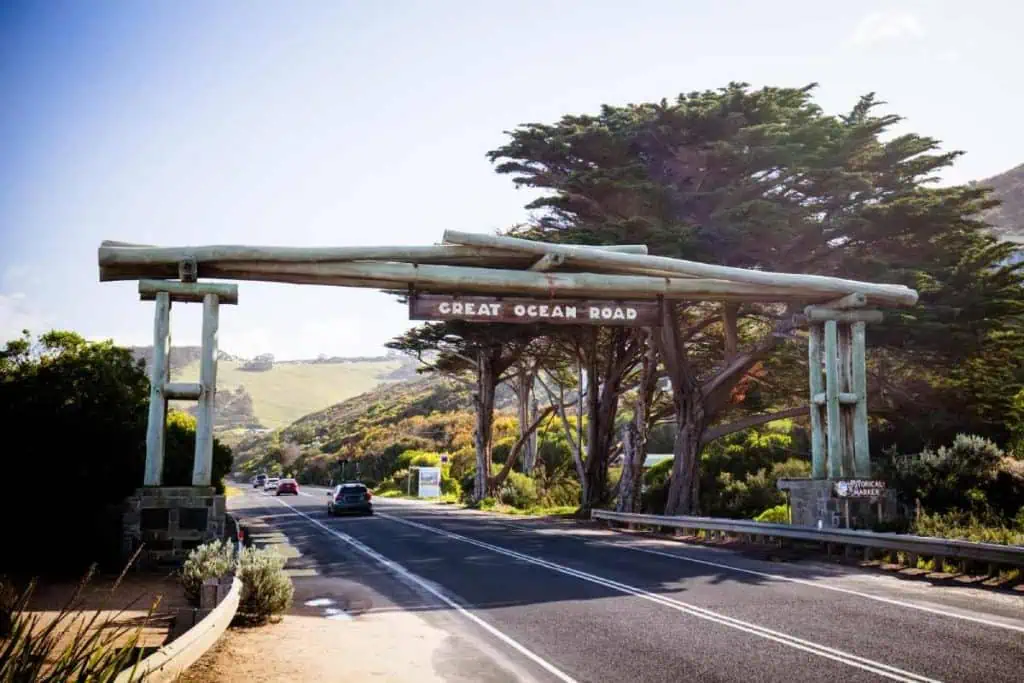 The iconic Great Ocean Road sign in Victoria, Australia, marking the start of this famous coastal drive. This gateway leads to some of the best places to stay on the Great Ocean Road, offering scenic views and unforgettable experiences along the journey.