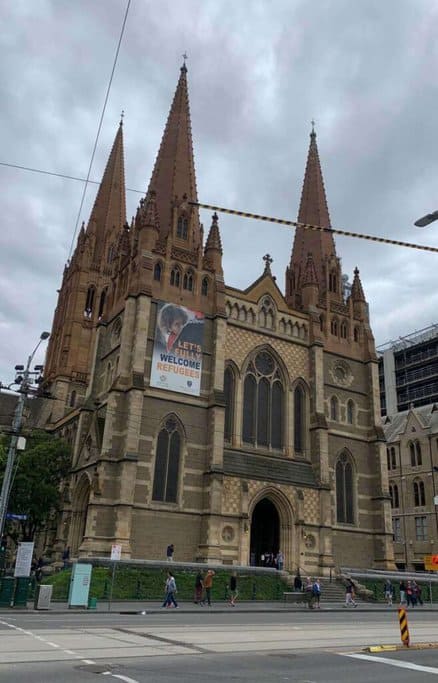 he grand facade of St. Paul's Cathedral in Melbourne, featuring its distinctive spires and Gothic Revival architecture. This historic building is one of Best Melbourne's Instagrammable Spots, offering a stunning backdrop for photos with its intricate details and prominent location in the city.