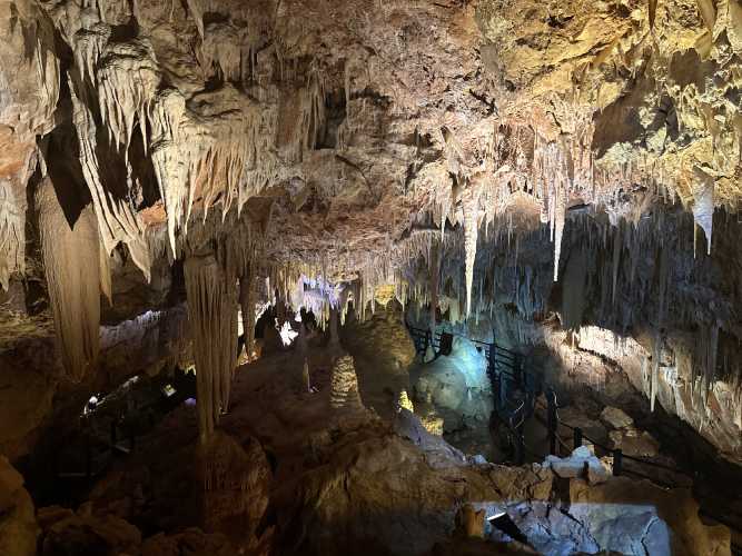 Stalactites and stalagmites frame The Tunnel of Doom in Ngilgi Cave, a dramatic and mysterious section that captures the essence of underground exploration.