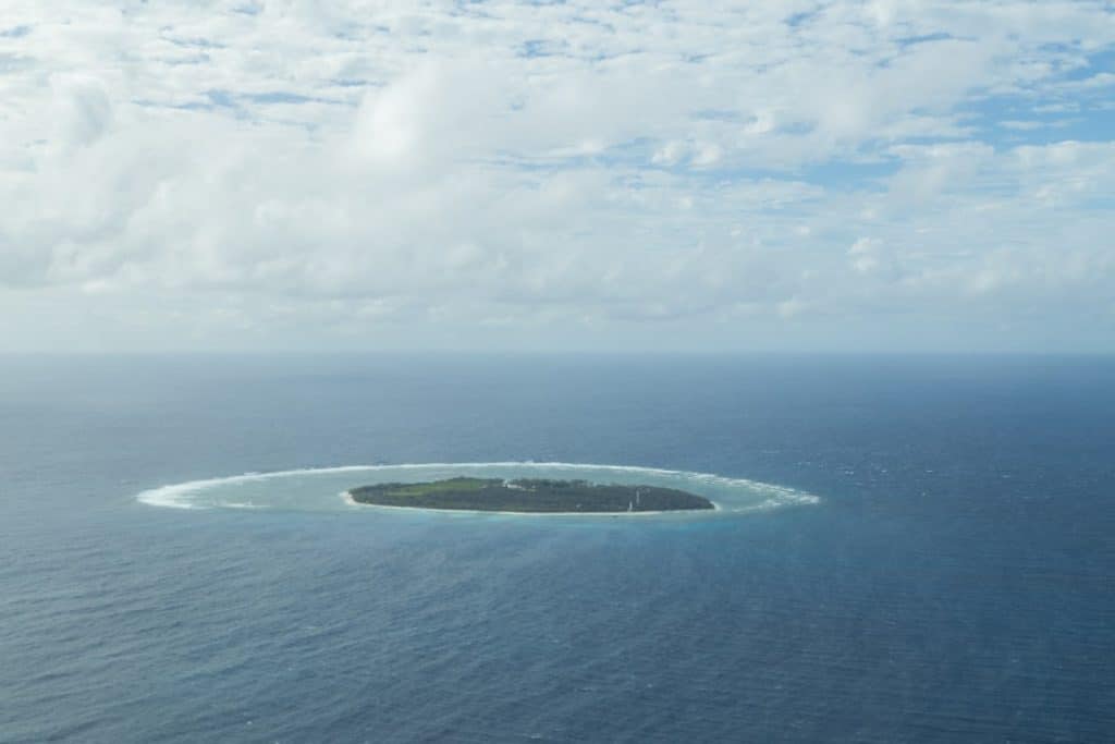 Aerial view of Lady Elliot Island, a coral cay surrounded by the Great Barrier Reef in Queensland, Australia. Perfect for outdoor adventure activities in Queensland, including snorkeling, diving, and exploring marine biodiversity.