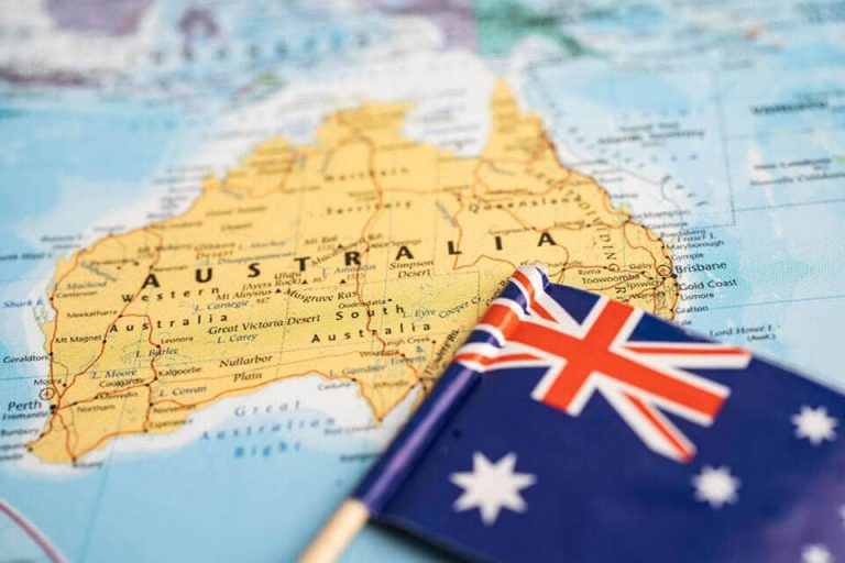 Map of Australia alongside the Australian flag, emphasizing the country's unique identity and geography in relation to the topic 'Is Australia Part of Europe?