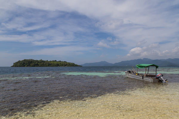 A boat, mountains and the Marovo Lagoon Solomon Islands