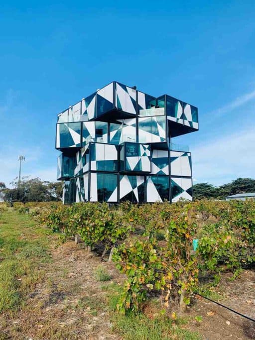 The d'Arenberg Cube in McLaren Vale, South Australia, surrounded by vineyards. This modern architectural landmark is featured in a blog post about Australia travel deals, showcasing unique and must-visit attractions.