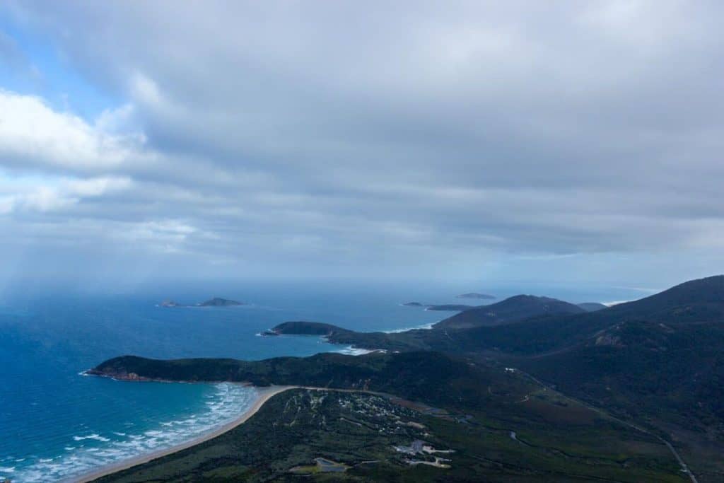 An expansive view from Mount Oberon Summit at Wilsons Promontory National Park, showcasing rugged coastlines and pristine beaches, a must-visit destination on hiking trails in Victoria’s national parks.