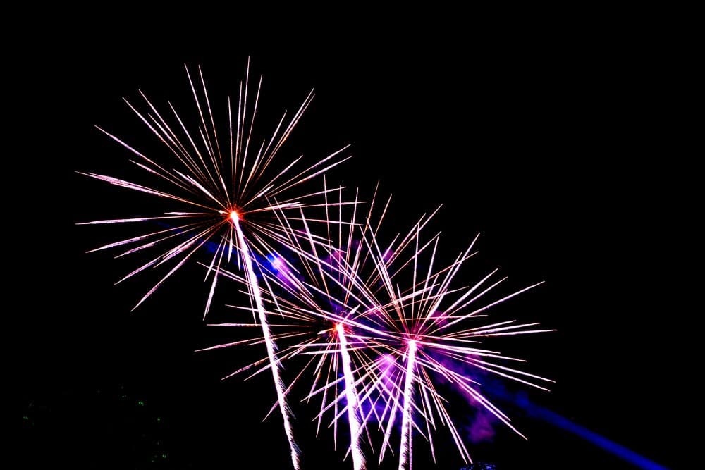 Bright fireworks lighting up the night sky, showcasing the excitement of New Year celebrations in Cairns, a highlight among Cairns Christmas activities.