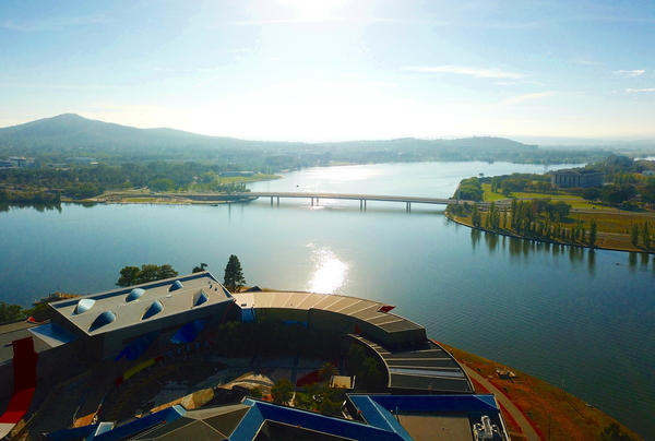 Panoramic view of Canberra (Australia) in daytime, featuring Lake Burley Griffin, Molonglo River and National Library of Australia.