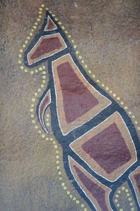 Ancient Aboriginal rock art of a kangaroo at Nourlangie in Kakadu National Park, featuring traditional ochre tones and intricate dot detailing. This significant cultural site offers a glimpse into Indigenous heritage and storytelling.