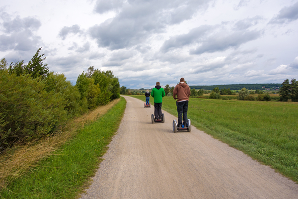 Group of Segway drivers on a rural path