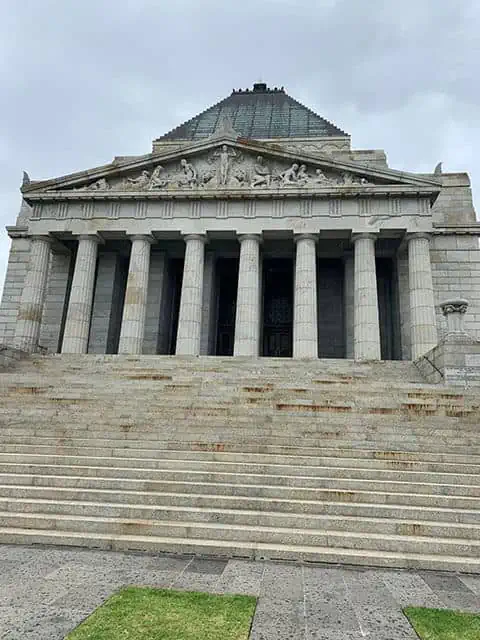 Front view of the Shrine of Remembrance in Melbourne, an architectural marvel that adds to the city's cultural richness, making Melbourne worth visiting.