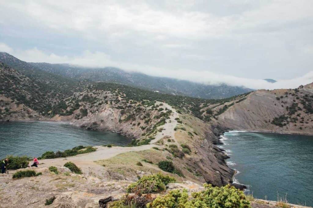 View of the rugged coastline and lush greenery of Stradbroke Island, highlighting a scenic destination featured in various travel deals in Australia.