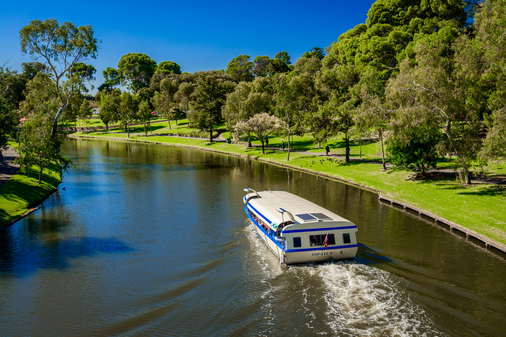 Adelaide, Australia - April 14, 2017: Iconic Pop-Eye boat  traveling upstream  Torrens river in Adelaide CBD on a bright day