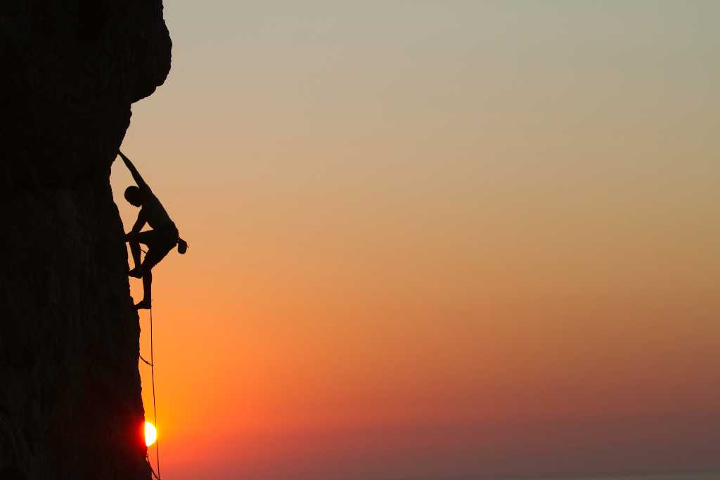 rock climbing with the sunset