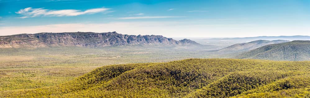 Sweeping views of the lush Victoria Valley in the Grampians, epitomizing the scenic tranquility accessible from the region's camping spots.