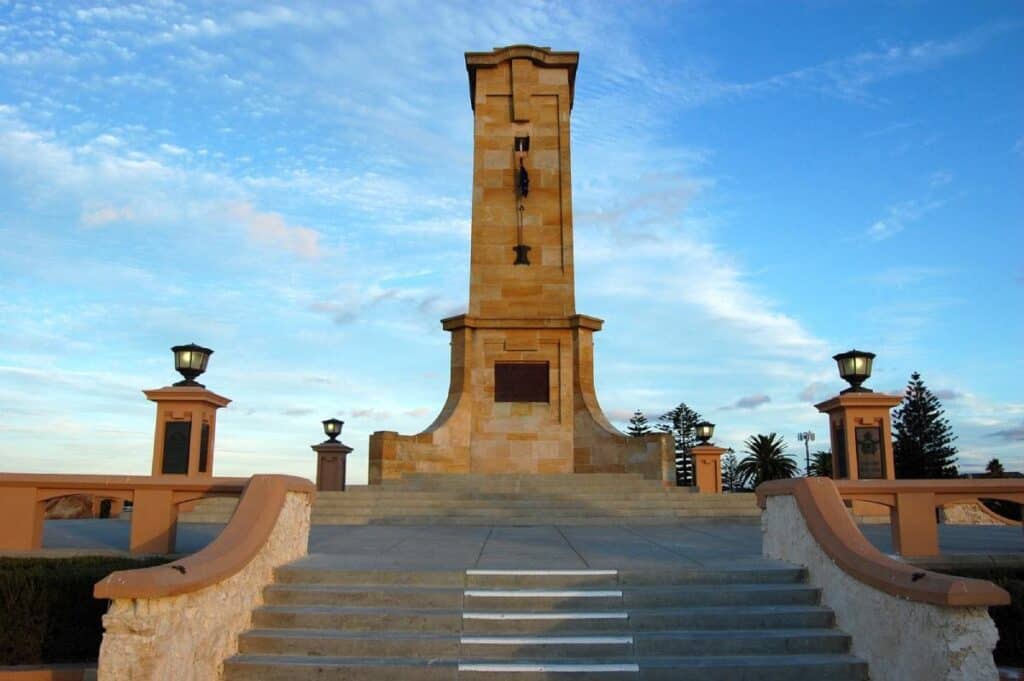 War memorial monument in Fremantle, Western Australia, at sunset with clear blue skies. This image is used in a blog post about Australia travel deals, highlighting significant landmarks to visit.