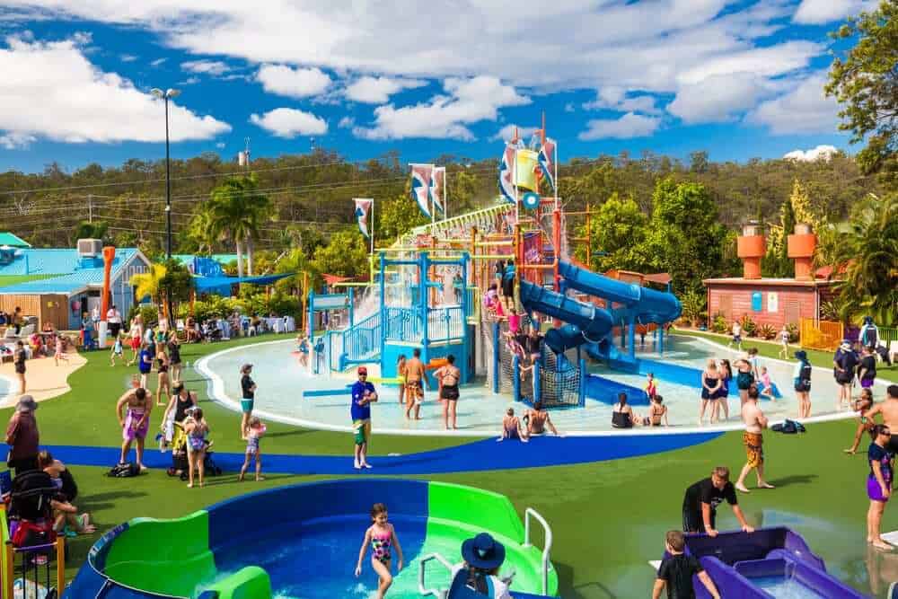 Families enjoying the colourful Wet'n'Wild Junior area, with its child-friendly slides and water activities, as featured in our in-depth Wet'n'Wild Gold Coast review.